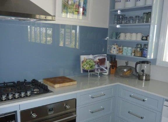 Custom blue splashback in a modern residential kitchen