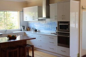 Custom white kitchen cabinetry in a home kitchen in Rockhampton