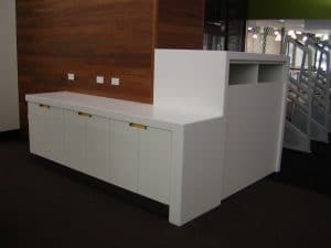 White cabinets in a library reception room