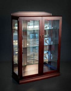 A custom timber display cabinet with glass shelves