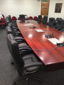 A large custom conference room table in an office
