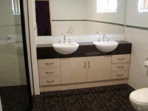A custom double bathroom sink cabinet in a bathroom