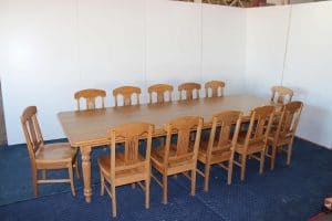 A large custom made timber dining table and chairs