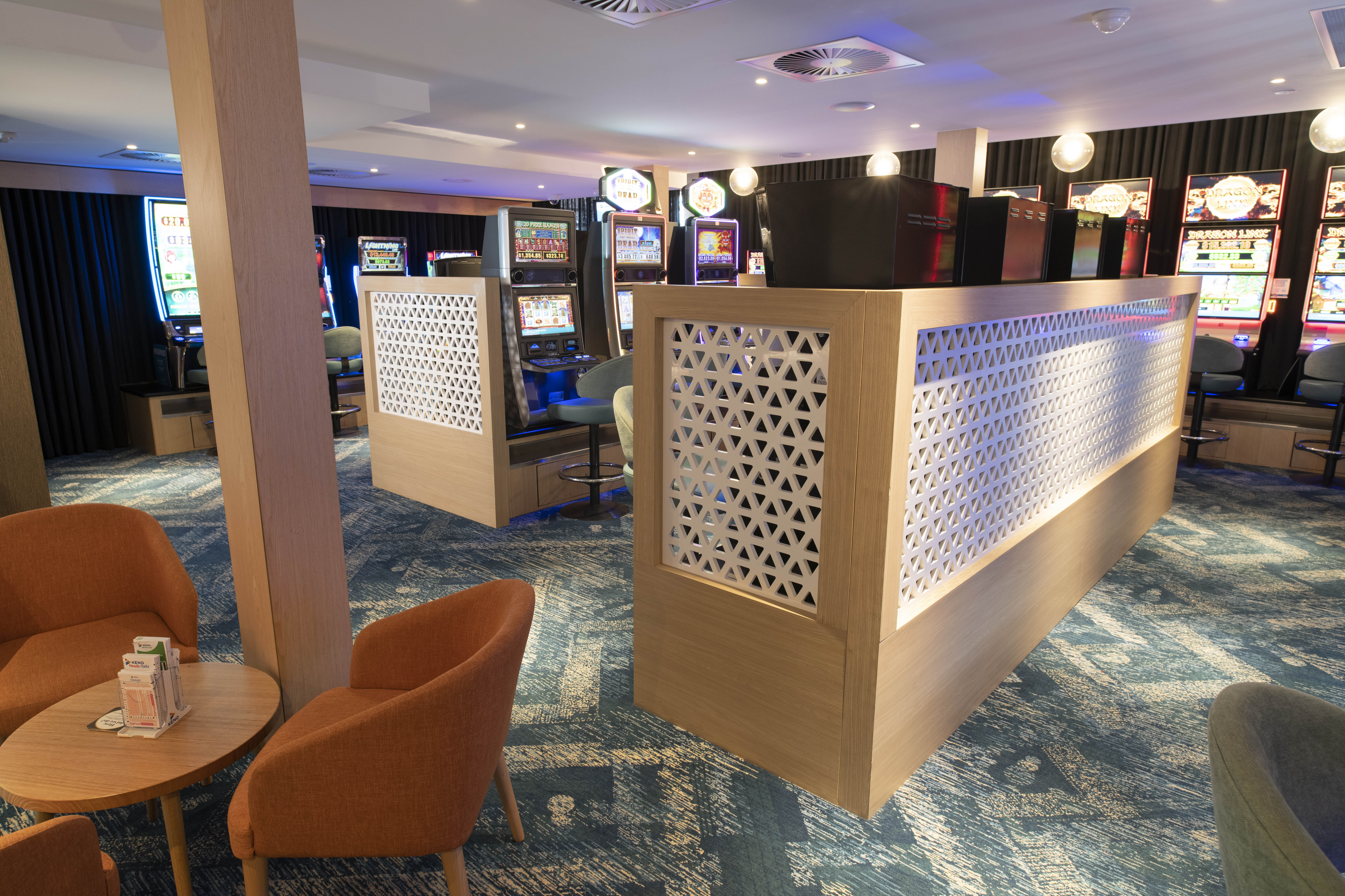Custom privacy screen installed in a pokies room at a club
